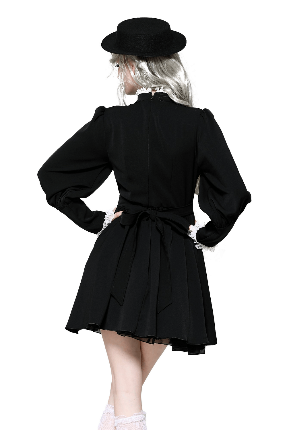 Elegant black Gothic Lolita dress with ruffled skirt and long sleeves, styled with a chic hat.