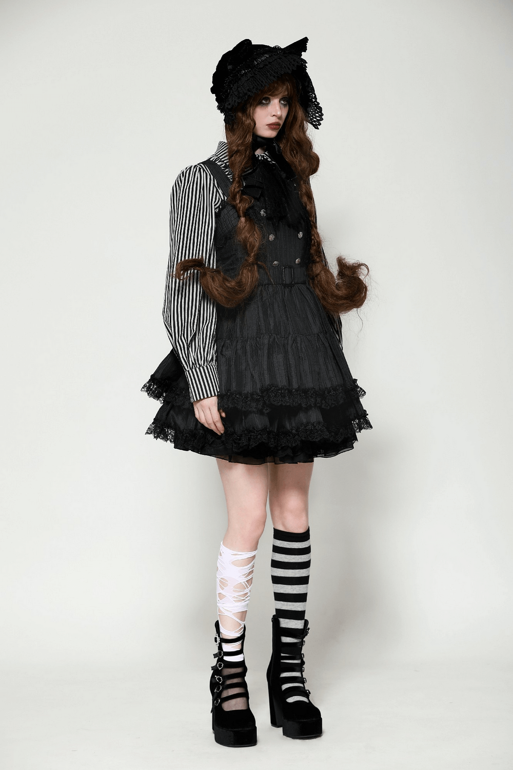 Elegant Gothic Lolita dress with lace ruffles, striped blouse, and knee-high striped socks for a dramatic look.