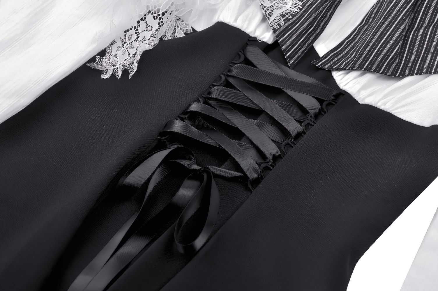 Close-up of black satin corset lacing on a gothic Lolita dress with lace details and dramatic ribbon accents.