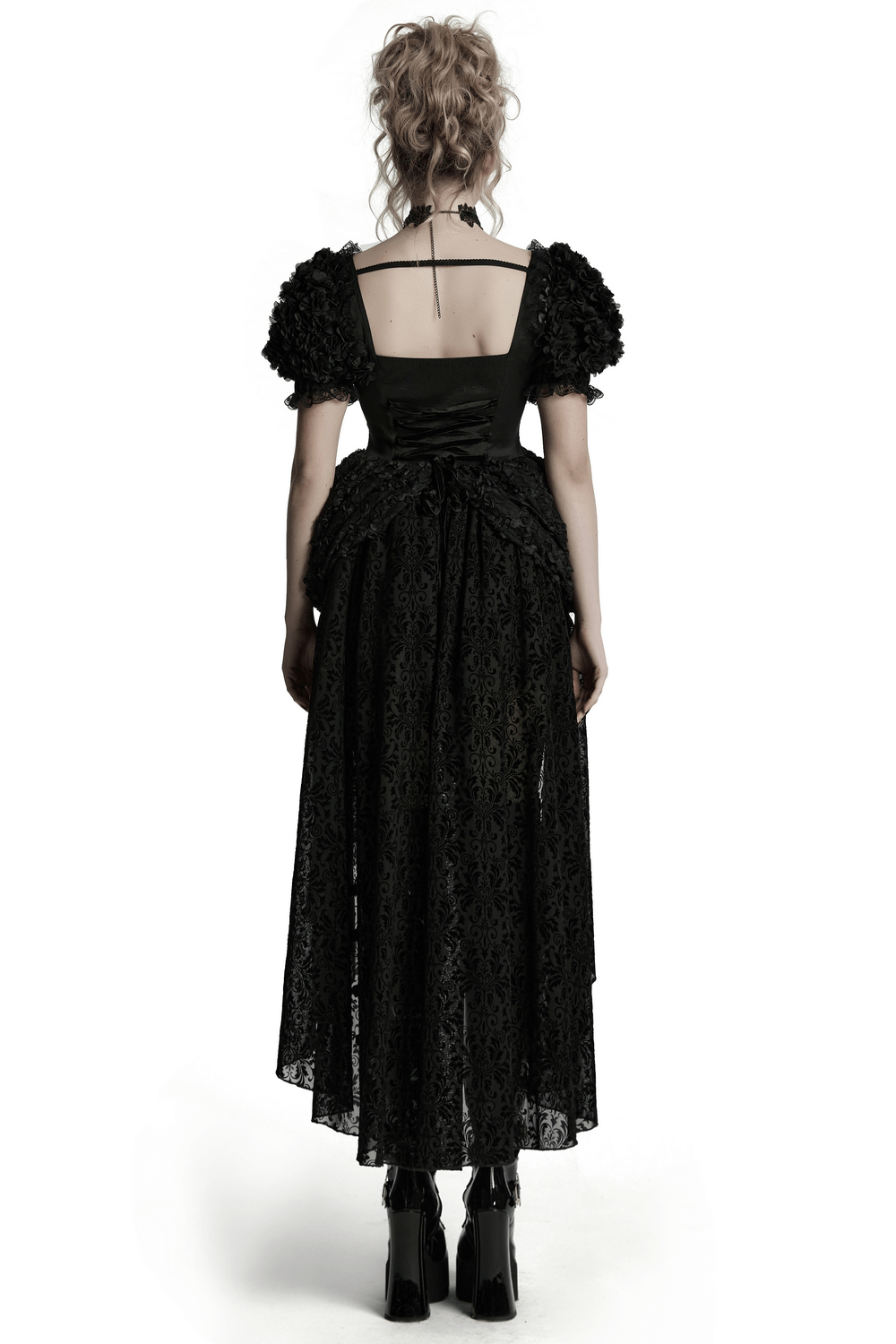 Back view of a gothic black lace dress with puff sleeves, showcasing romantic 3D embroidery and a voluminous skirt.