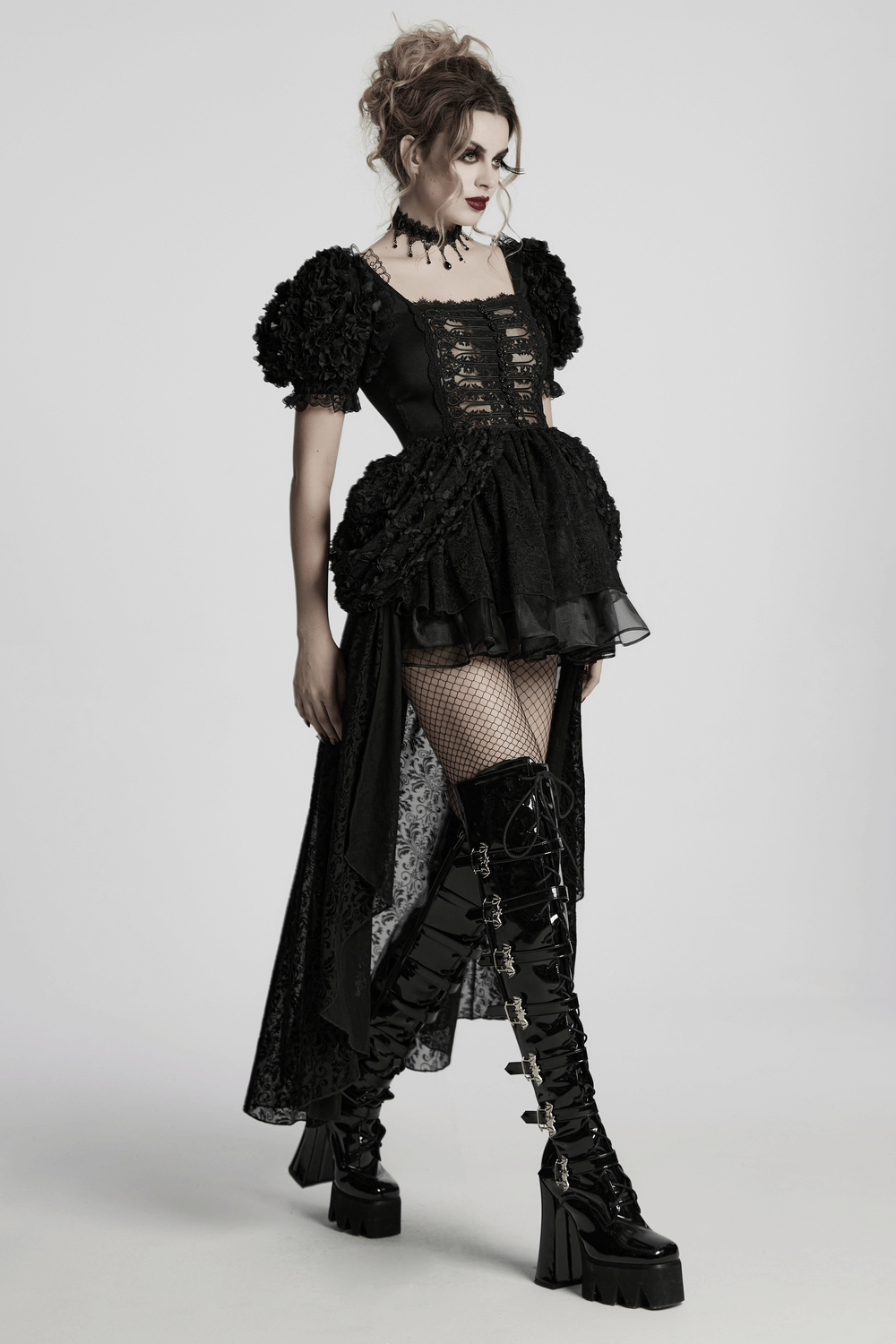 Gothic black lace dress with puff sleeves, corset styling, and a voluminous skirt for elegant, dramatic looks.