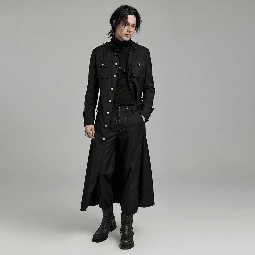 Stylish man in a long black military-style trench coat with fitted design and distinctive details.