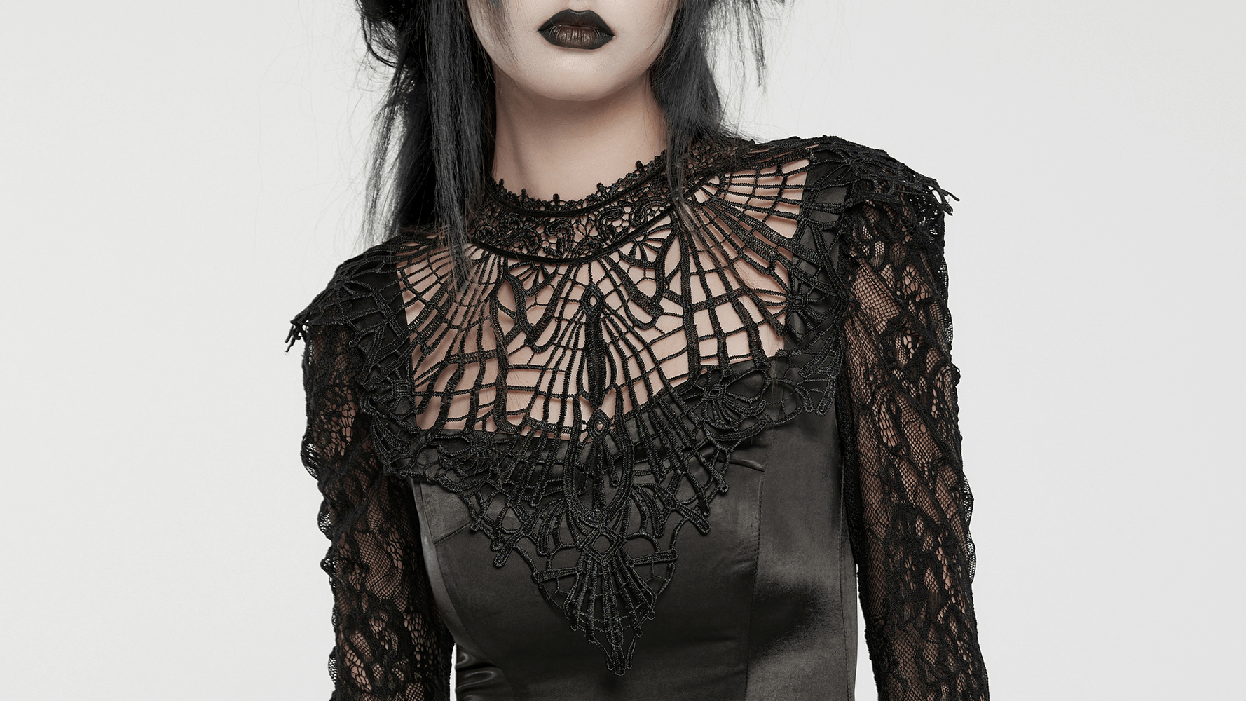 Elegant gothic dress with intricate lace sleeves and alluring floral mesh detailing.