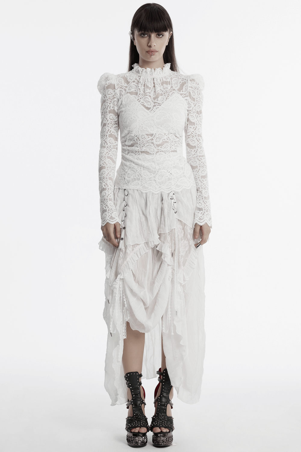 Elegant long-sleeved white lace blouse with ruffled collar and dramatic sleeves, perfect for evening events.