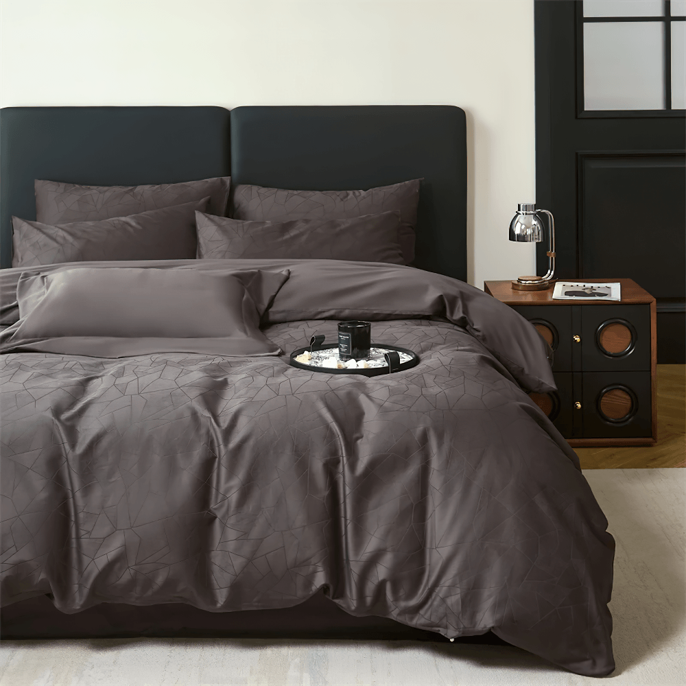 Long Staple Cotton Sateen Jacquard Bedding Set styled on a modern bed with dark sheets and pillowcases.