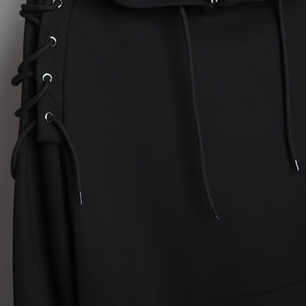 Close-up of black hooded sweatshirt with stylish lace detail on shoulders for a chic casual look.