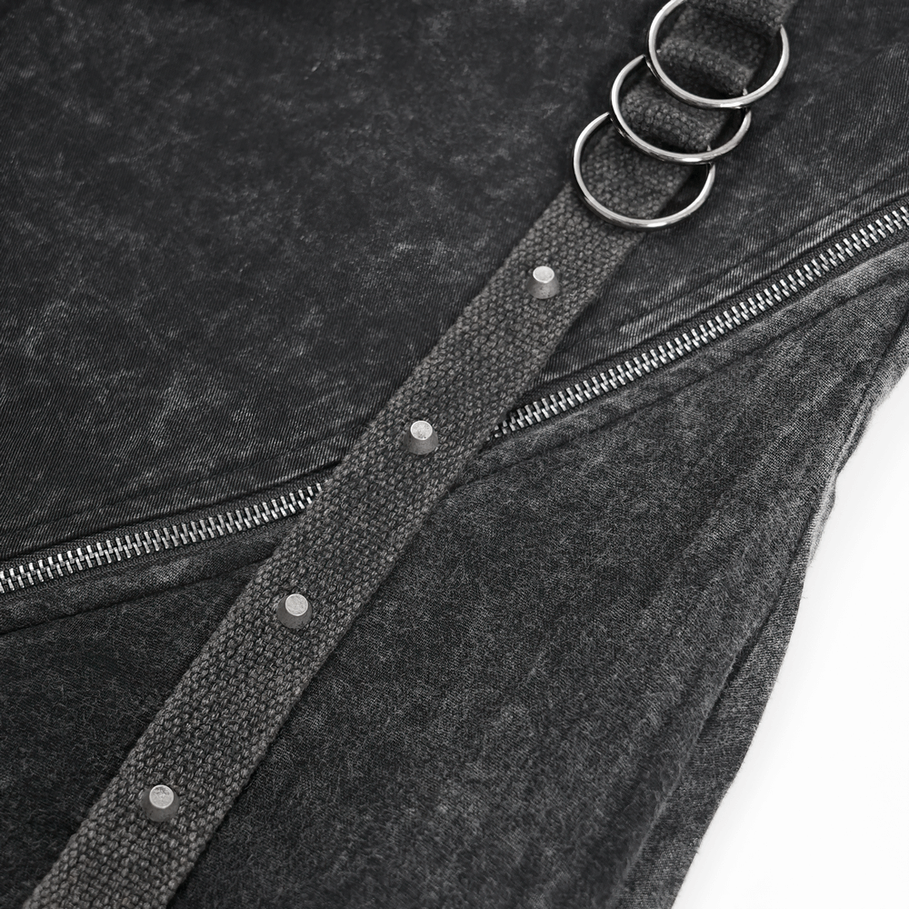 Close-up of a stylish black fabric with Zipper and metal rings, showcasing urban fashion details.