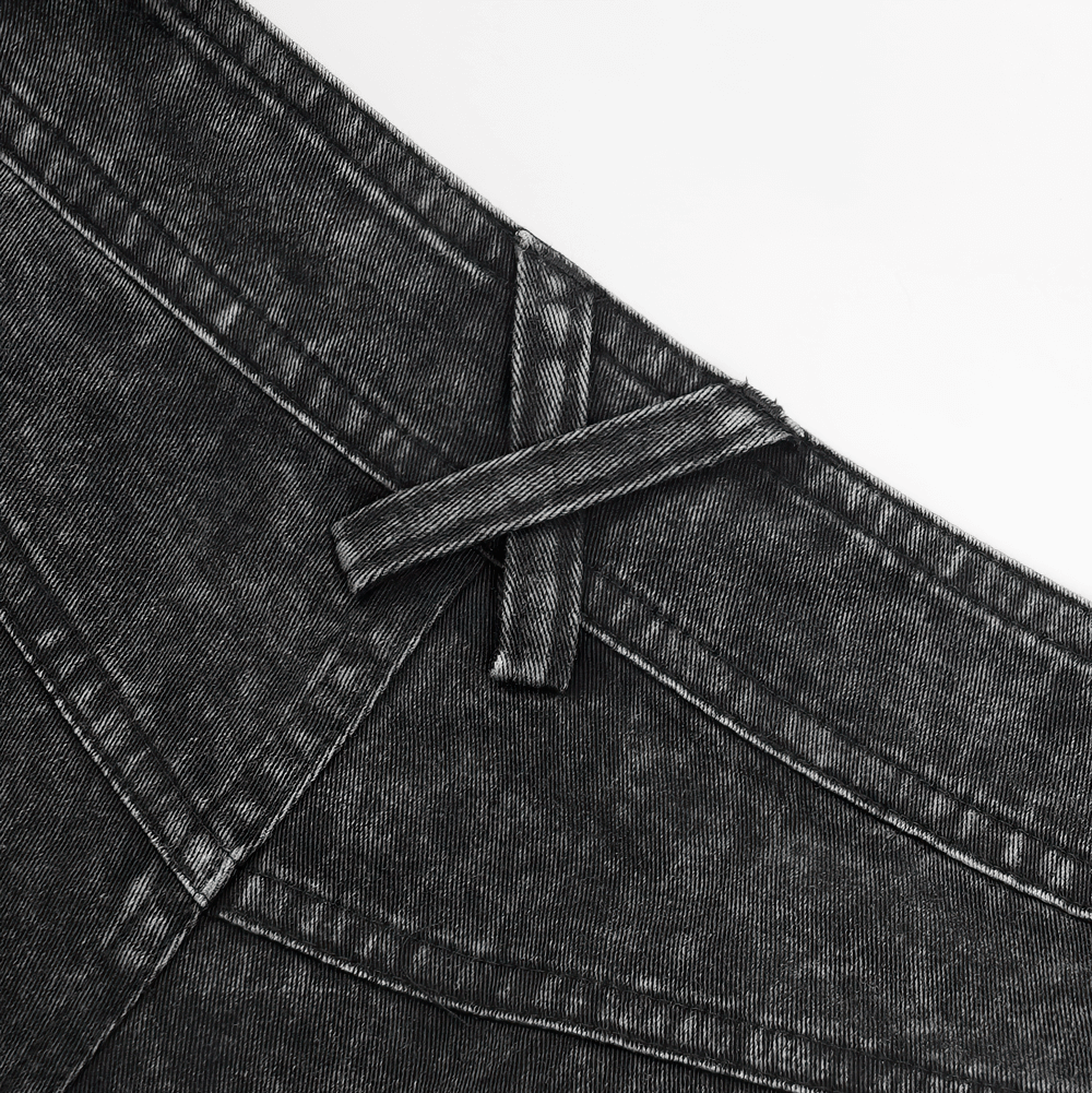 Close-up of the waistband on stylish loose distressed jeans with a unique design detail. Perfect for urban outfits.