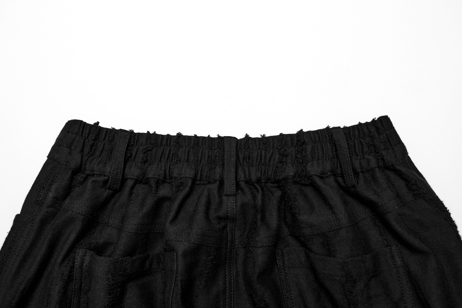 Loose-fit black gothic cargo pants with decayed texture and elastic waistband for edgy streetwear style.