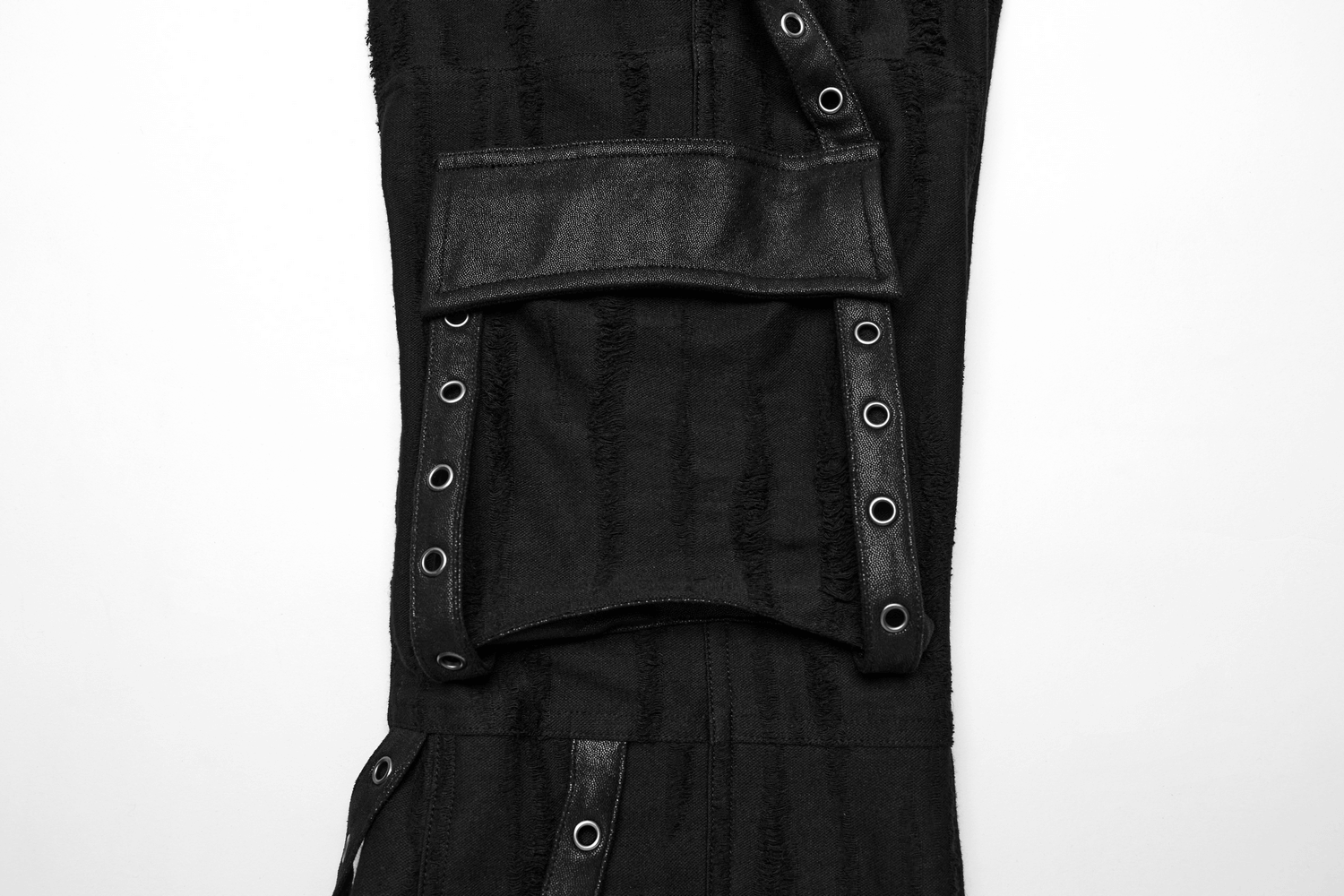 Loose-fit black gothic cargo pants with o-rings and decayed textured fabric.