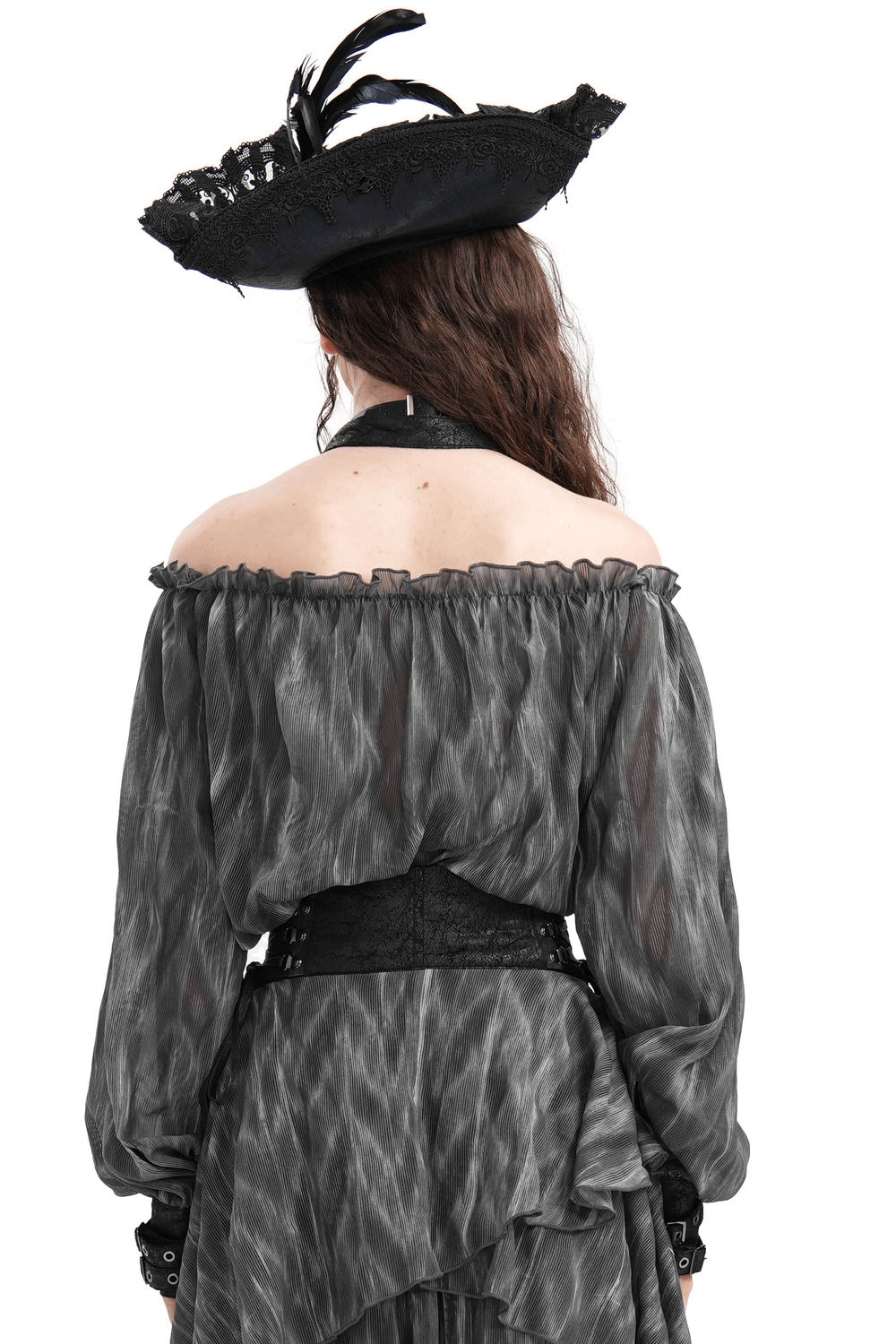 Back view of a dark off-shoulder top with flowing sleeves, paired with a stylish hat adorned with feathers.