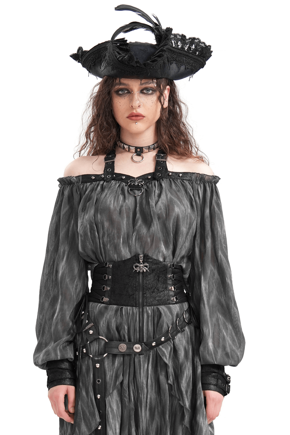 Dark off-shoulder top with buckled straps, gothic elements, and a dramatic hat for a bold, edgy look.