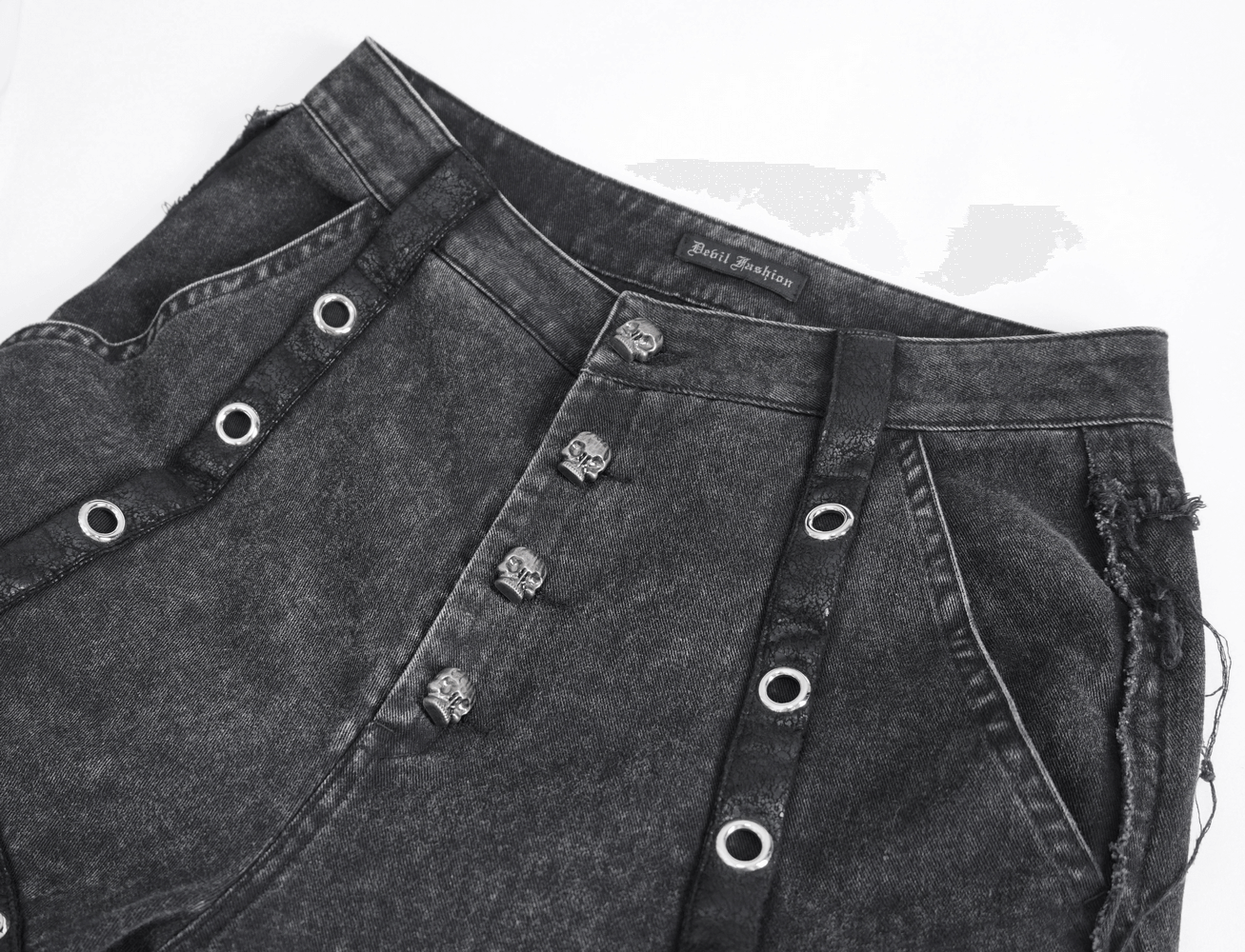 Close-up of loose punk eyelets long flared pants for women featuring unique buttons and gothic design.