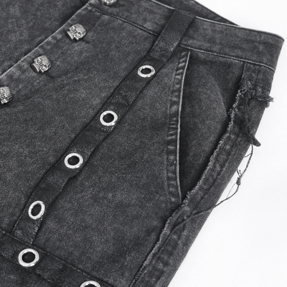 Close-up of gothic women’s flared pants with eyelets and button closure, perfect for a punk rock outfit.