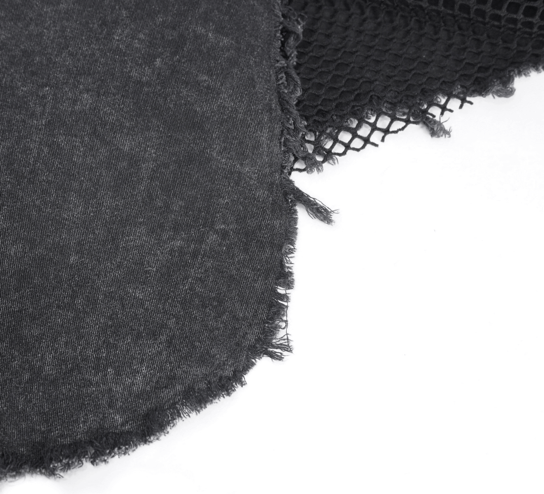 Close-up of black denim and mesh fabric, perfect for gothic punk flared pants with edgy flair.