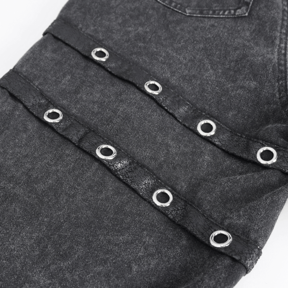 Close-up of loose punk eyelets on gothic flared pants for women, showcasing dramatic silver hardware and unique style.