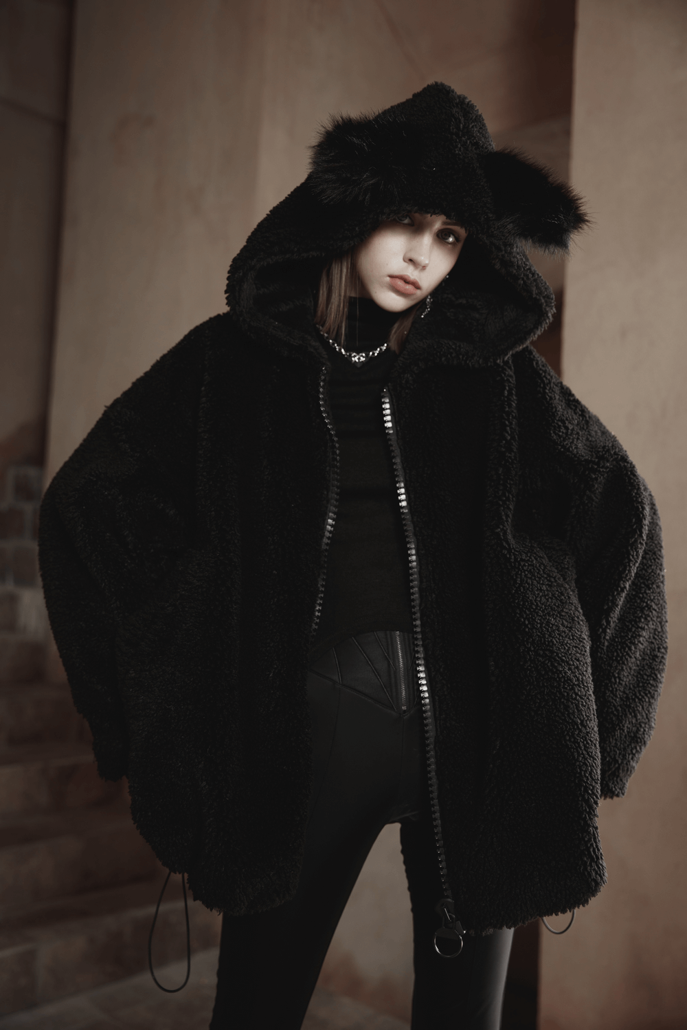 Loose warm black fox ear hooded jacket with zipper for women, perfect for chilly days and stylish layering.