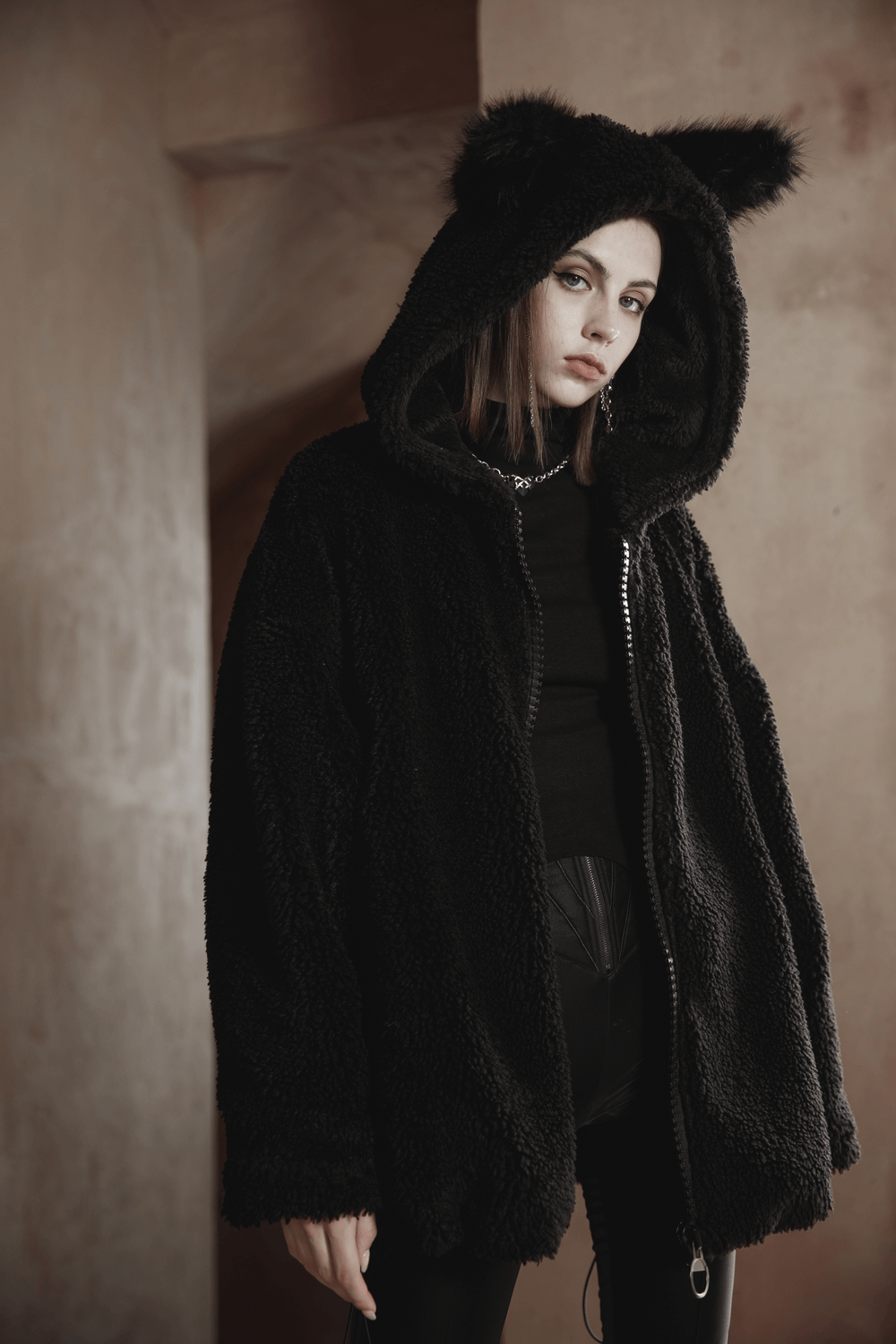 Loose warm black fox ear hooded jacket with zipper for women, perfect for chilly days.