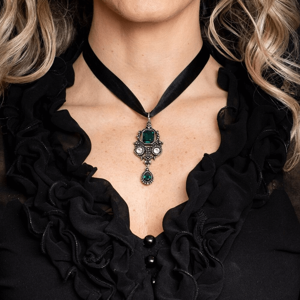 Lost Jewels of Paris Gothic Pendant with Green Crystals worn on a black ruffled blouse.