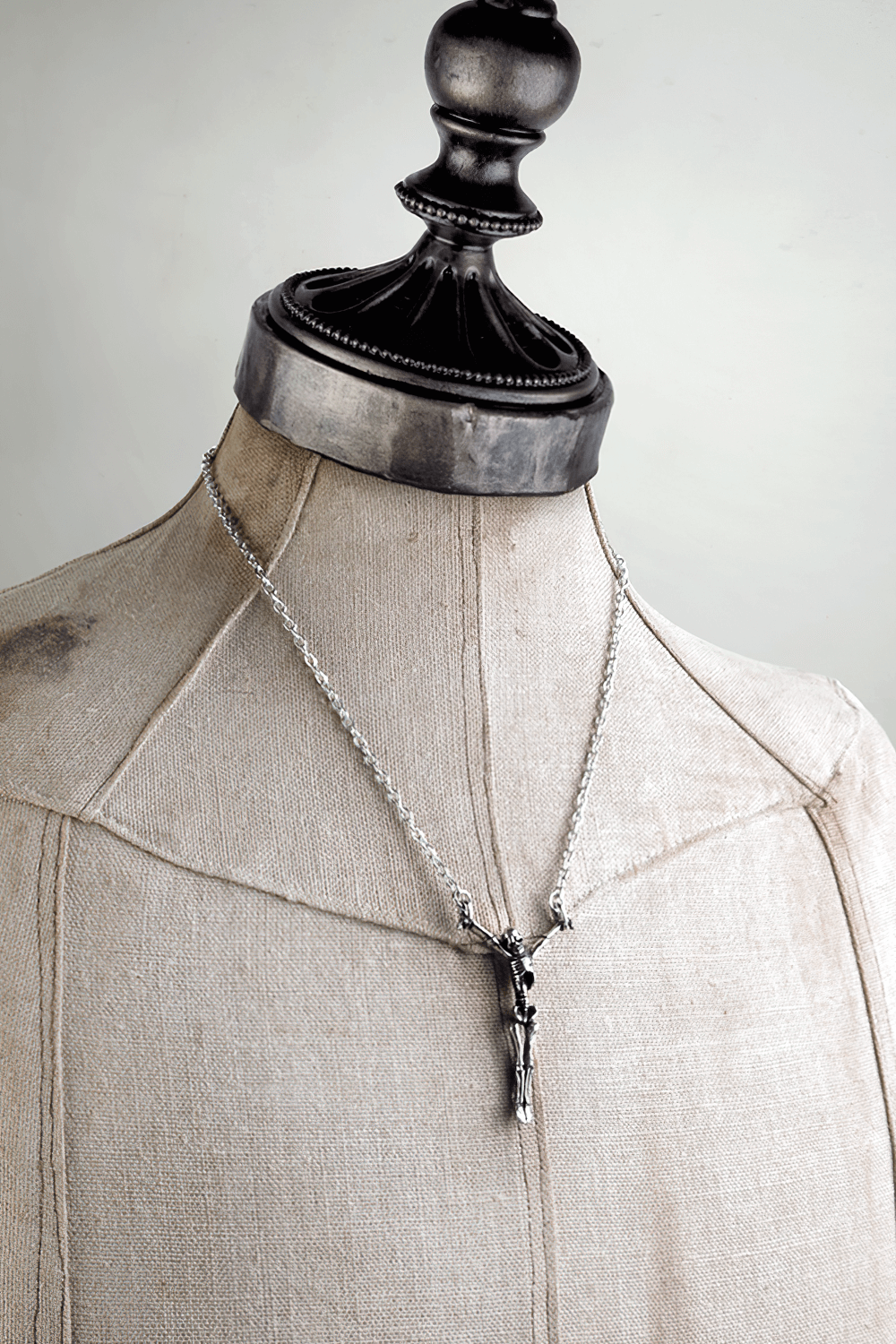 Lost Soul Skeleton Pendant on a display mannequin showcasing gothic macabre jewelry style.
