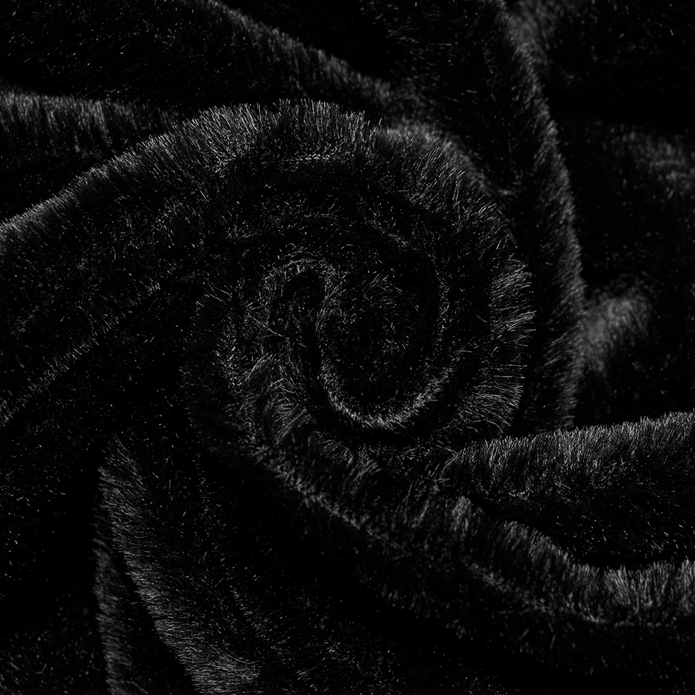 Close-up of luxurious black velvet fabric, showcasing its soft texture and rich appearance for gothic fashion.
