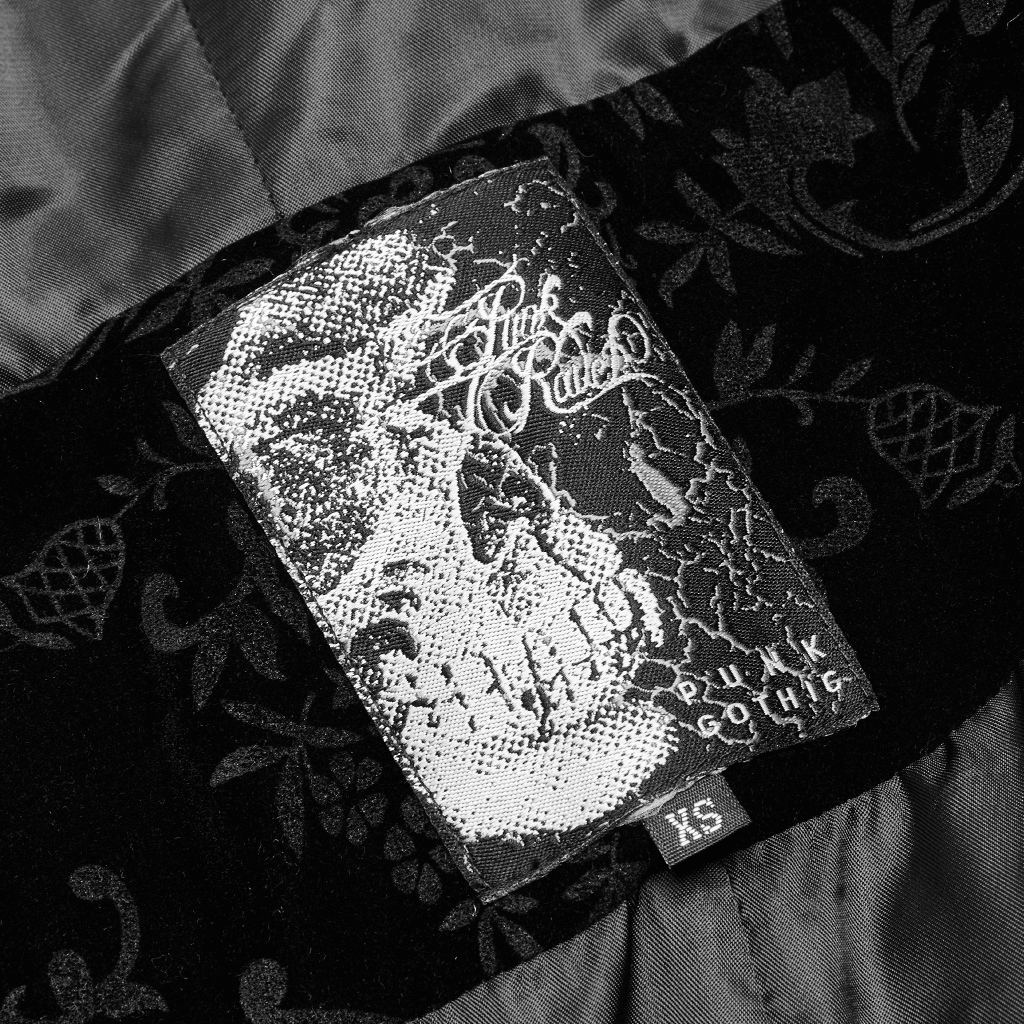 Gothic cloak label featuring a skull design and intricate floral patterns, showcasing punk style elegance.