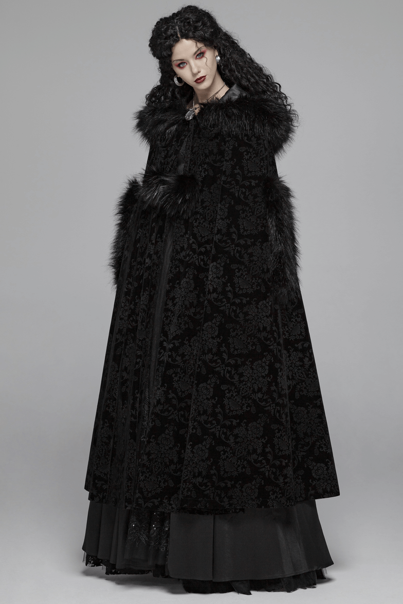 Elegant lady in a black velvet hooded Gothic cloak with fur trim, showcasing a dramatic full-length design.
