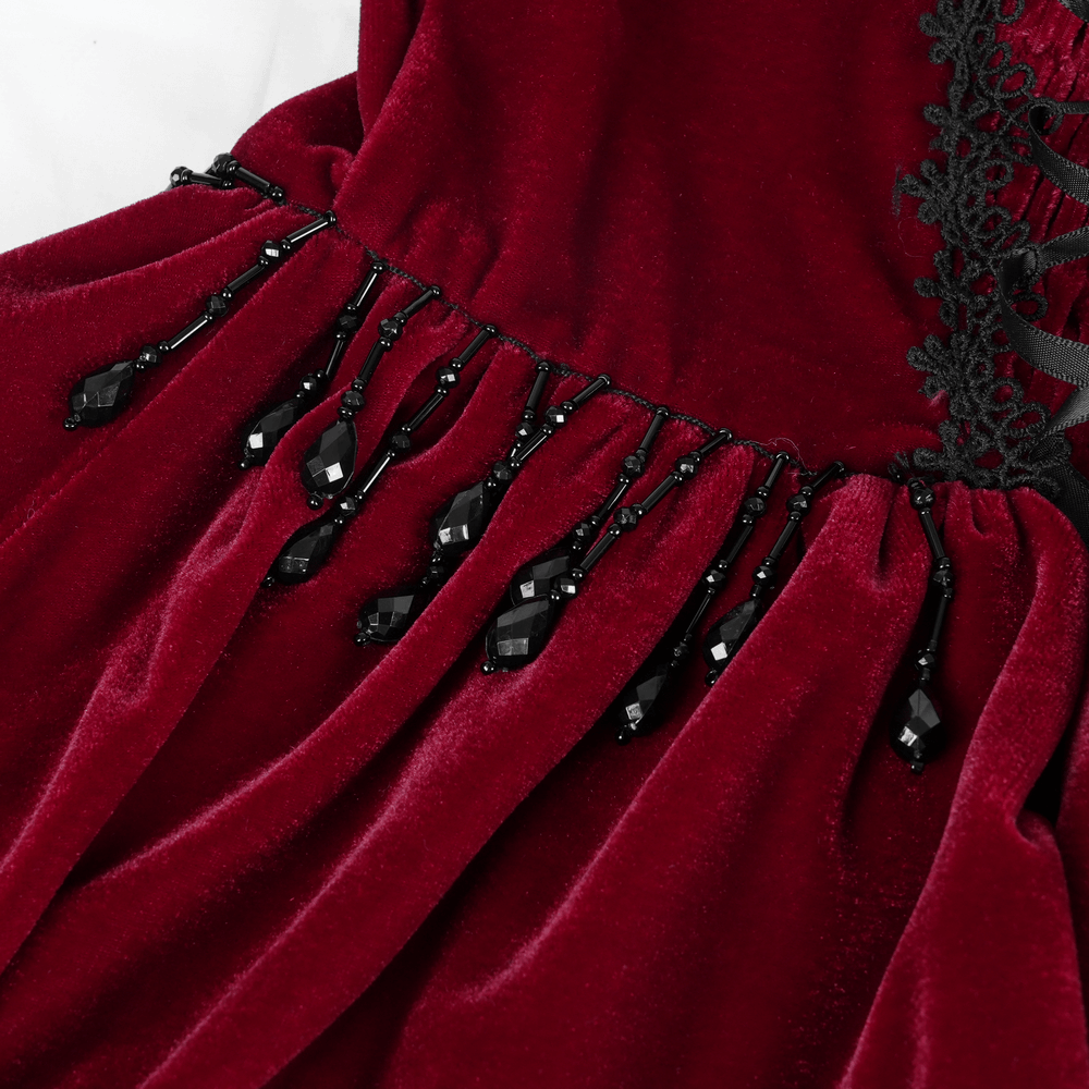 Luxurious burgundy velvet dress with black beaded fringe and lace details, perfect for a gothic Lolita style.