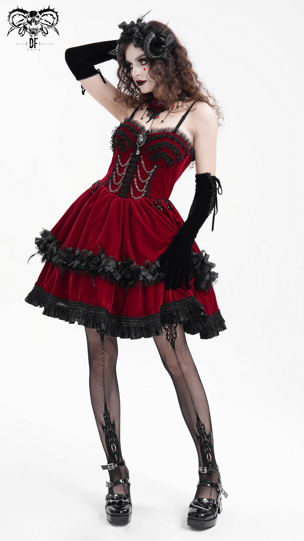 Luxurious burgundy velvet Gothic Lolita dress with black lace trim, chain details, and floral accents worn by a woman in gothic style.