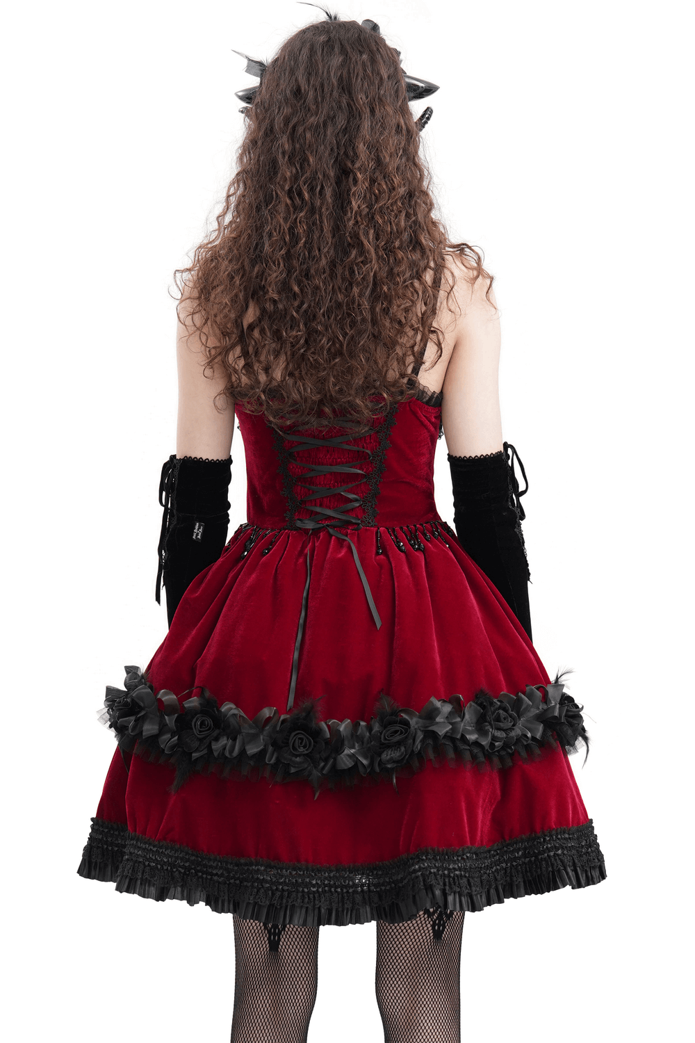 Gothic Lolita wearing a luxurious burgundy velvet dress with black lace trim and floral accents, showcasing a Victorian gothic style.