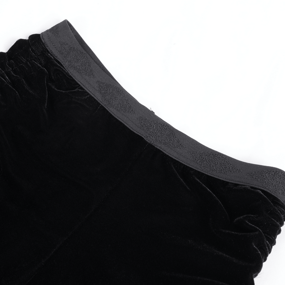 Luxurious black velvet shorts featuring a ruched waistband and elegant detailing for a gothic look.