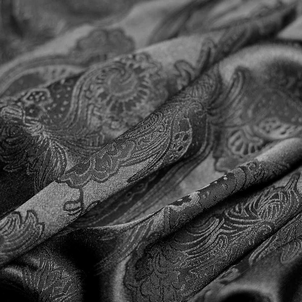 Luxurious black fabric with intricate damask patterns, adding elegance and texture to gothic attire.