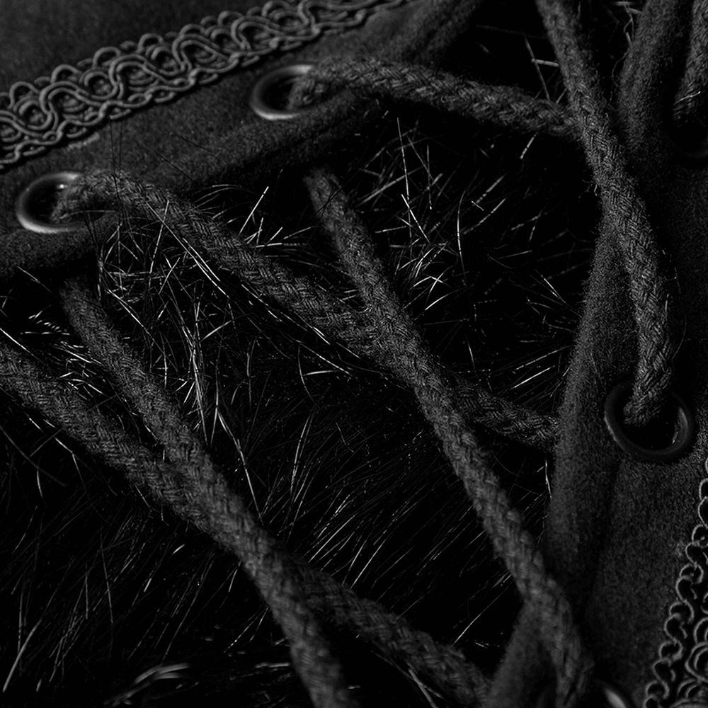 Close-up of luxurious black lace and fur detailing on a Gothic cloak for witchy winter fashion.