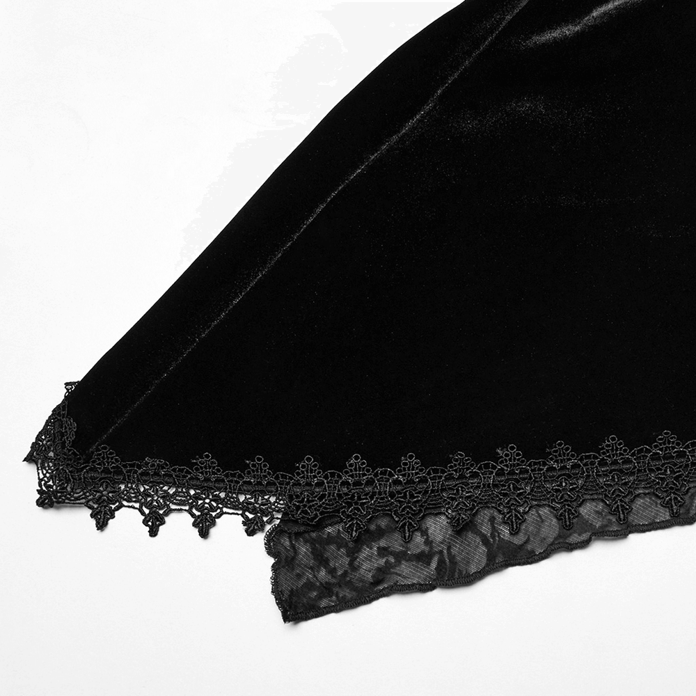 Elegant black velvet fabric with intricate lace trim, showcasing gothic-inspired design details.