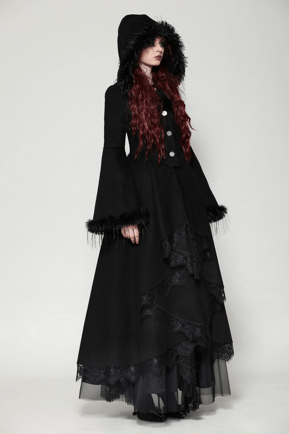 Elegant woman in a luxurious lace-trimmed gothic hooded coat with faux fur, showcasing a dramatic style and dark allure.