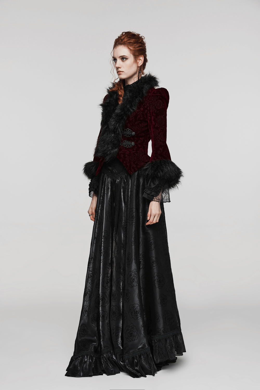 Stunning model in a fur-trimmed gothic short jacket and long black skirt, embracing a luxurious and elegant style.