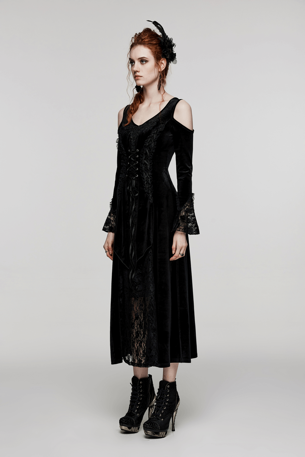Luxurious velvet goth gown with sexy lace detail and cold-shoulder sleeves, perfect for gothic elegance.