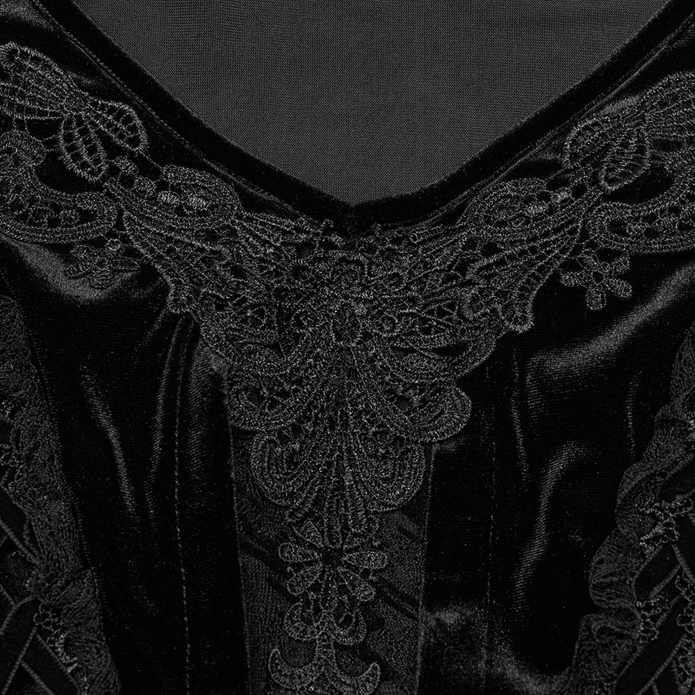 Close-up of luxurious velvet goth gown featuring intricate black lace detail and a daring V-neck design.