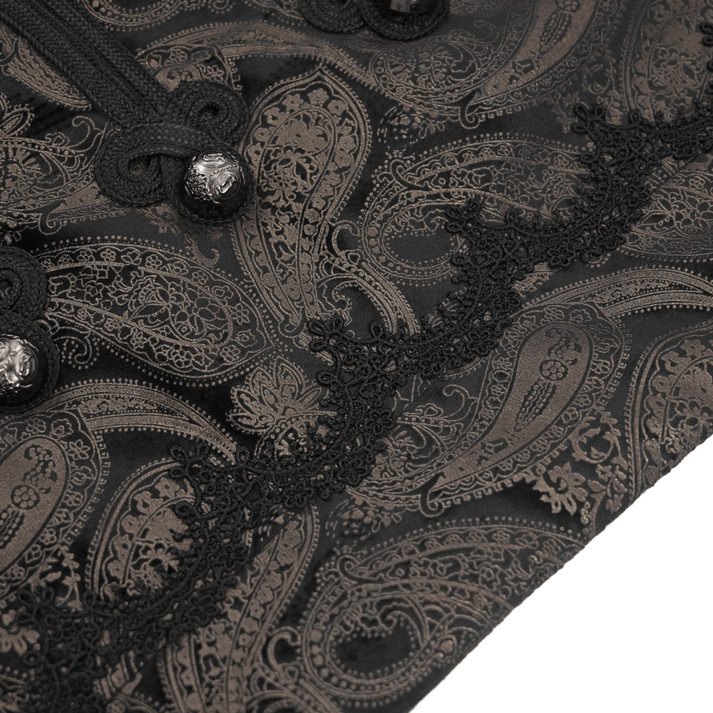 Luxurious brocade paisley fabric of a men's waistcoat with intricate silver button and lace detailing.