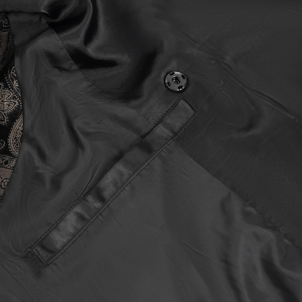 Close-up of a luxurious black waistcoat showcasing its sleek fabric and decorative silver button detail.