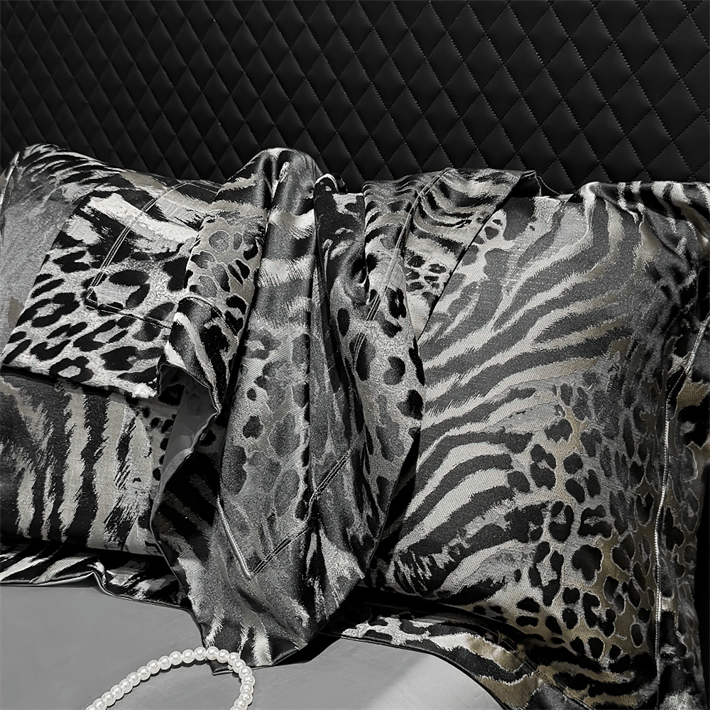 Luxury Leopard Jacquard Egyptian Cotton Bedding Set with stylish black and white animal print pillows.