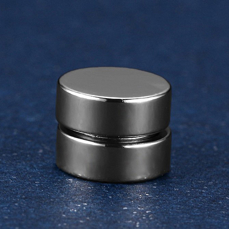 Sleek round magnetic stud earring in polished stainless steel - stylish unisex accessory.