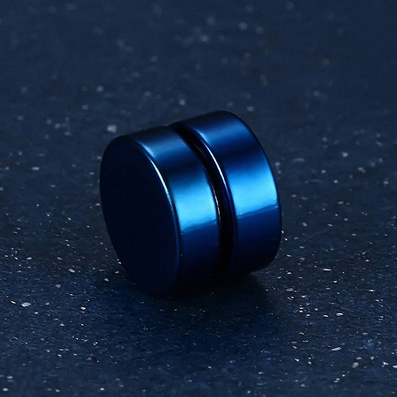 Close-up of stylish blue magnetic stud earring on a dark surface, perfect for unisex casual fashion and accessories.