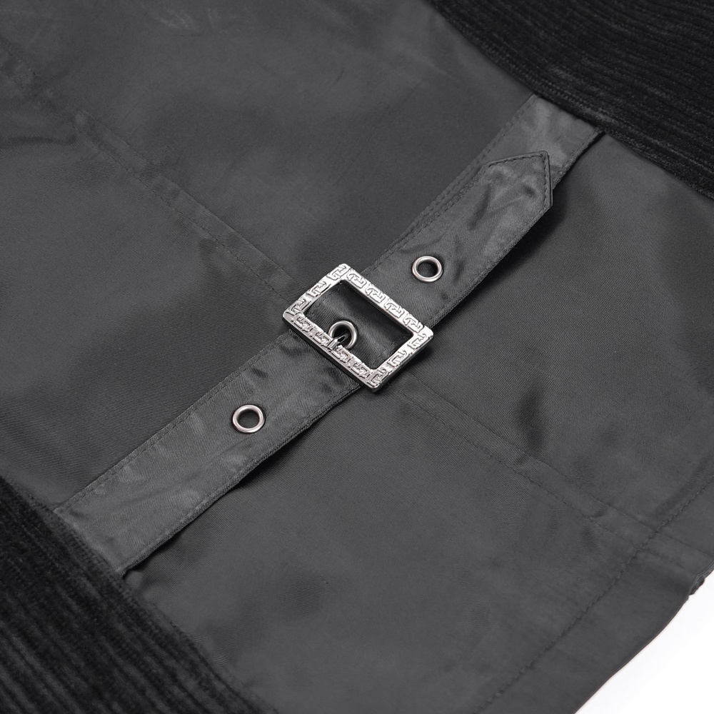 Close-up of the stylish buckle and fastening on a black brocade waistcoat with intricate details.