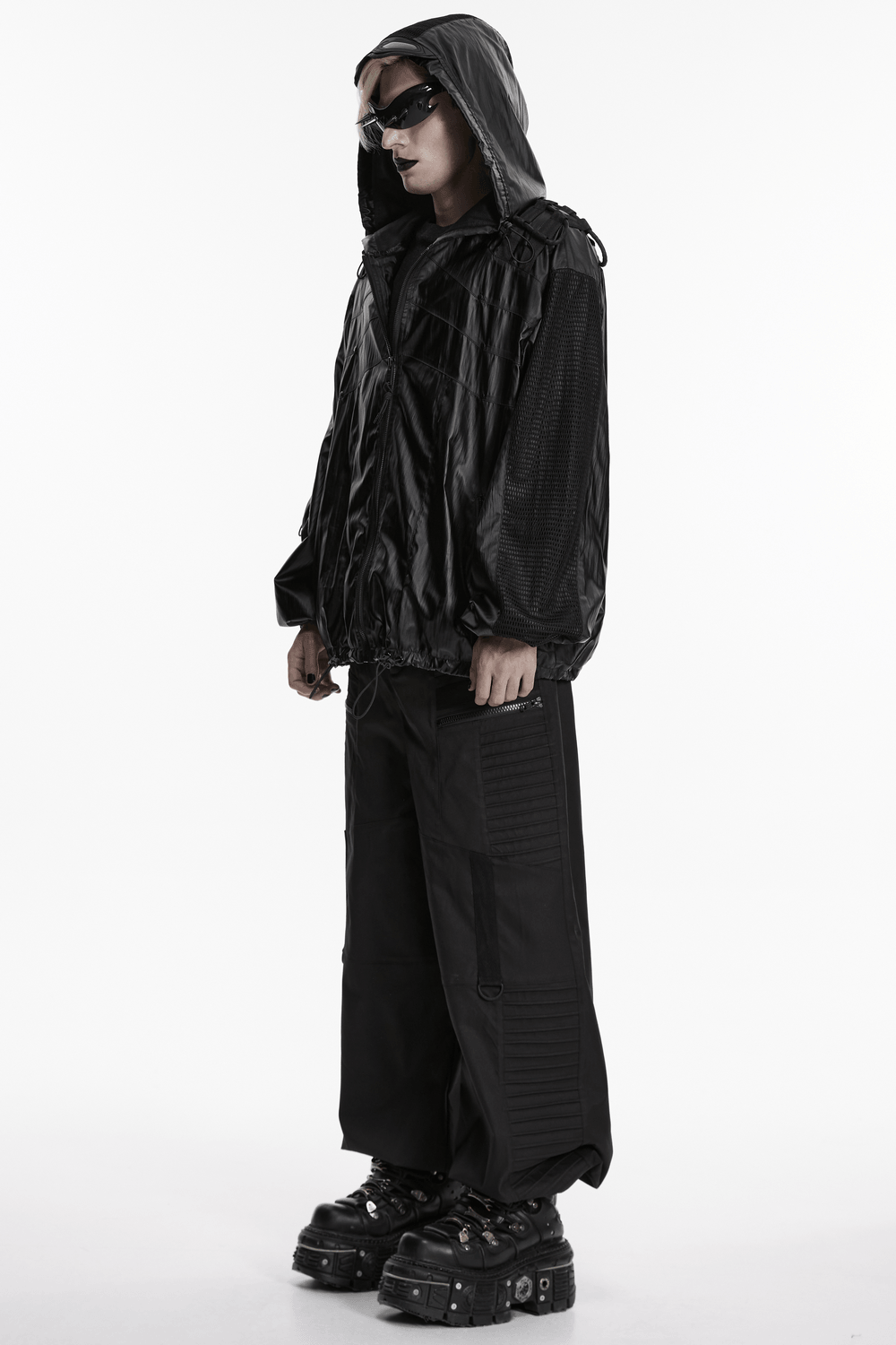 Male Black Cyberpunk Hooded Waterproof Mesh Jacket worn by a model, showcasing style and functionality in urban fashion.