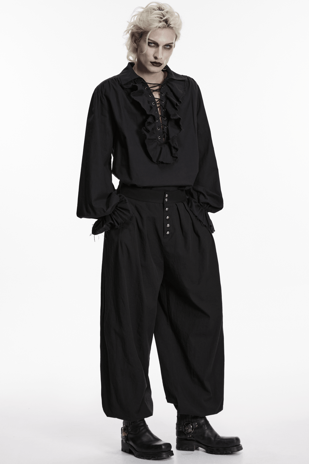 Male Black Gothic Pleated Lantern Tapered Pants worn by a model in a stylish black outfit.