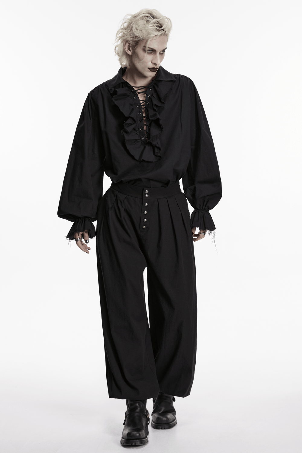 Male Black Gothic Pleated Lantern Tapered Pants styled with a ruffled black shirt and edgy black boots.