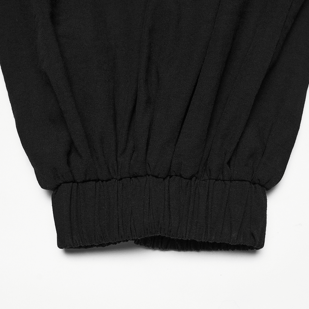 Close-up of the cuff of Male Black Gothic Pleated Lantern Tapered Pants showcasing the elastic detail.