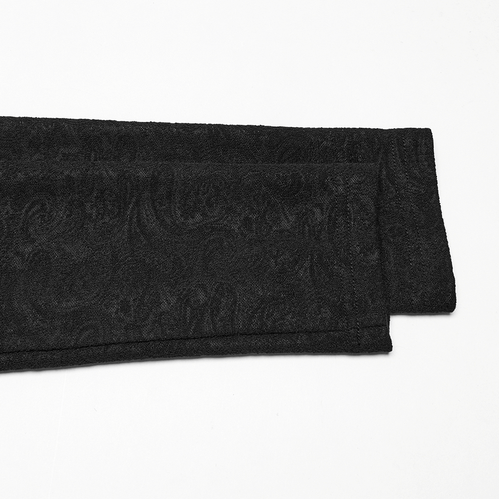 Melodramatic black jacquard fabric showcasing intricate patterns, ideal for gothic fashion designs.