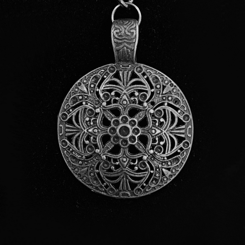 Intricate black medallion necklace pendant with gothic floral design, perfect accessory for elegant outfits.